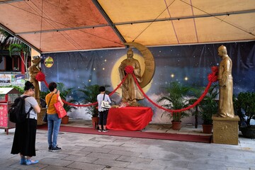  People praying at Wong Tai Sin Temple, Wong Tai Sin Temple is a well known shrine and tourist attraction in Hong Kong.