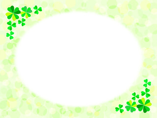 四つ葉と三つ葉のクローバーと緑色のふんわり水玉背景に白い円形のフレーム