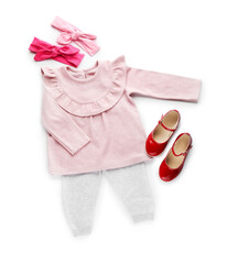 Children's clothes and accessories on white background