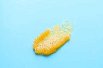 Sample of body scrub on color background