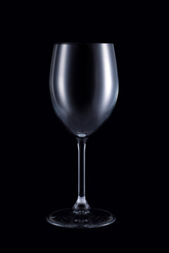 Empty wine glass isolated on dark background. Studio