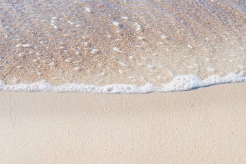 Soft wave of the sea on the sandy beach.Soft focus,blurred image.