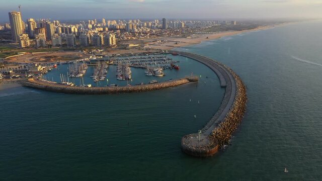 Aerial Shot Of Groyne By Harbor At Ocean, Drone Descending Over Tetrapods - Ashdod, Israel