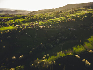 Spring landscape in Slovakia. Polana region, Hrinova. Green spring rural hills landscape, fields, flowering trees, organic farming © Zedspider