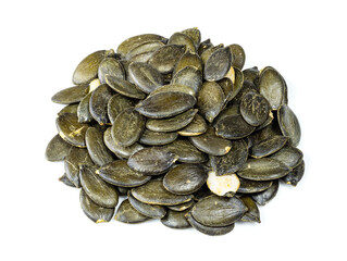 handful of styrian pumpkin seeds closeup on white