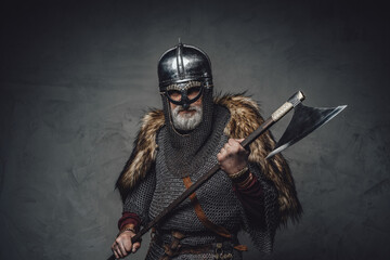 Naklejka premium Studio shot of antique old age viking with axe