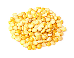 pile of dried split yellow peas closeup on white