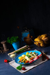 Asparagus with black forest ham, carrots and hollandaise sauce.