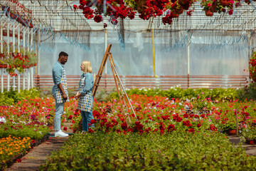 Gardeners working in a greenhouse