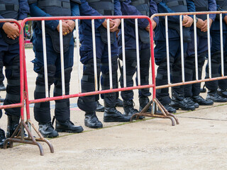 Riot police practice shields and baton
