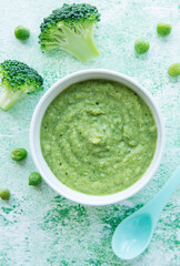 Baby food. Organic green broccoli  puree with ingredients.