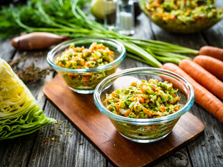 Fresh spring vegetable salad on wooden table
