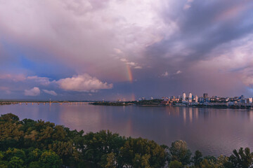 Rainbow is double in the most of photo. Beautiful double rainbow in the city after the rain. Photos taken from the drone.