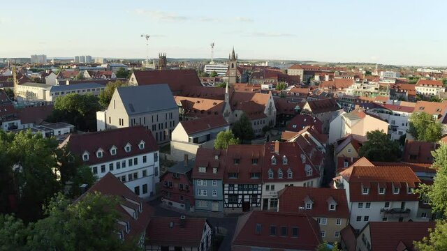 Aerial: Moving Forward Over A German Monastery Nestled In An Old Historic Village, With High Pitched Roofs, Gothic Architecture, And Crowded Buildings - Erfurt, Germany