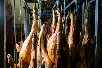 Details of some serrano hams prepared to send in a warehouse. Iberian Ham - obrazy, fototapety, plakaty