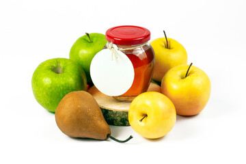 Homemade natural jam production concept. Transparent glass jar with jam inside on cross cut wooden logs, pear and various color apples isolated on white background. Part of set.
