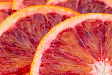 Grapefruits close-up. Slice of blood red ripe grapefruits background. Part of set.