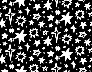 Seamless childish monochrome cosmos pattern with whitte silhouette of different stars on black background. Vector texture of the universe. Vector wallpaper with hand drawn space