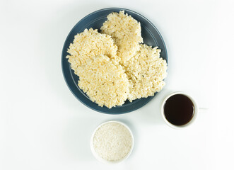 Rengginang or chips made from traditional glutinous rice from Indonesia served on ceramic plates