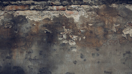 Textured background of an old worn shabby damaged exterior cement wall