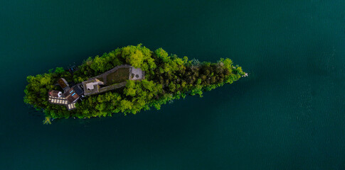 Island on Lauerzersee in Switzerland. Lake in the Swiss Alps.