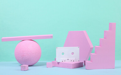 Audio cassette with pink geometric shapas on blue background. Concept art. Minimalism