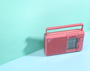 Pink fm radio receiver on a blue background with trendy shadows. Creative layout. Minimalistic...