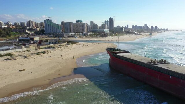 Aerial Shot Of Ship Moored At Beach Against Sky On Sunny Day - Ashdod, Israel