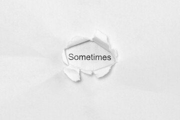Word sometimes on white isolated background, the inscription through the wound hole in paper....
