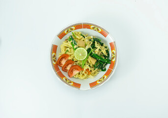 Indonesian Mie Goreng or Fried Noodle with egg traditional Indonesian or Chinese food with mustard greens