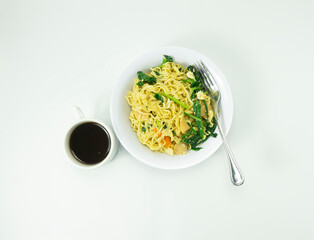 Indonesian Mie Goreng Nyemek or Fried Noodle with egg traditional Indonesian or Chinese food with mustard greens