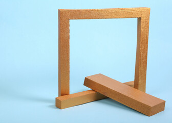 Gold frame with geometric shapes on a blue background