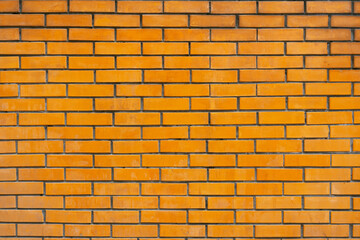 orange brick wall background. Orange Brick Wall of the House on Street.