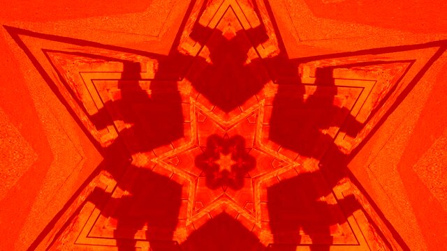 Abstract video of A Red Kaleidoscope spinning in a star formation.