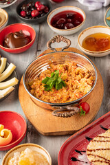 Traditional Turkish Breakfast served with traditional turkish tea on stone table