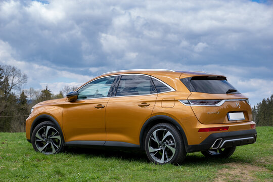DS 7 Crossback E-Tense 4x4 hybrid on the background of rural landscape