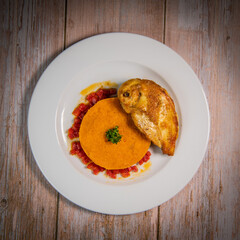 Chicken supreme recipe, gently cooked with 5 spices, sweet potato mousseline, peppers cut in half. High quality photo