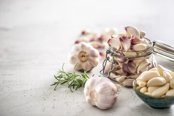 Garlic concept consisting of a jar full of lovely aromatic garlic cloves