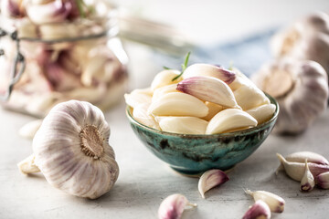 Ripe and aromatic homegrown garlic served in the blue rustic bowl