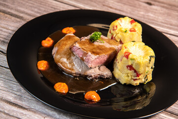 Recipe for roasted veal in butter, piquillo pesto, canele of polebta with crunchy vegetables, honey rosemary sauce. High quality photo
