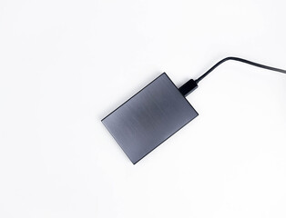 Gray external hard drive for data storage isolated on white background