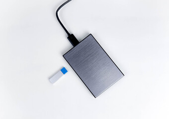 Gray External hard drive HDD and USB flash memory isolated on the white background