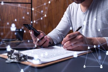 A potential employee signing the contract to boost his career and gain new opportunities in personal growth. Concept of success. Checking the detail of the deal at smartphone. Social media icons