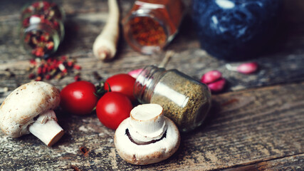 Spices and vegetable, closeup. Rustic style. Food and spices cooking. Ingredients on dark wooden board.