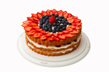 Strawberry cake with whipped cream. Cake decorated with berries. Homemade cake on a white background. Isolate.