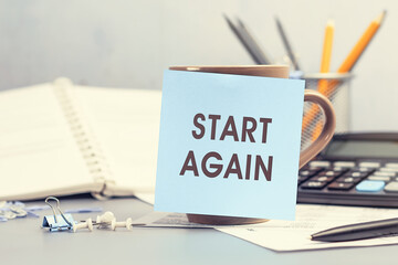 Start Again - concept of text on sticky note. Work and study concept