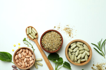 Fototapeta na wymiar Concept of herbal medicine pills on white background