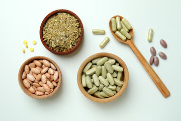 Fototapeta na wymiar Concept of herbal medicine pills on white background