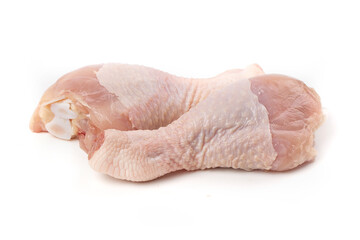 Raw chicken drumsticks, isolated on white background.