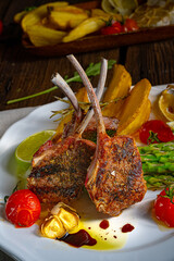 Lamb chops marinated in herbs with green asparagus and lime